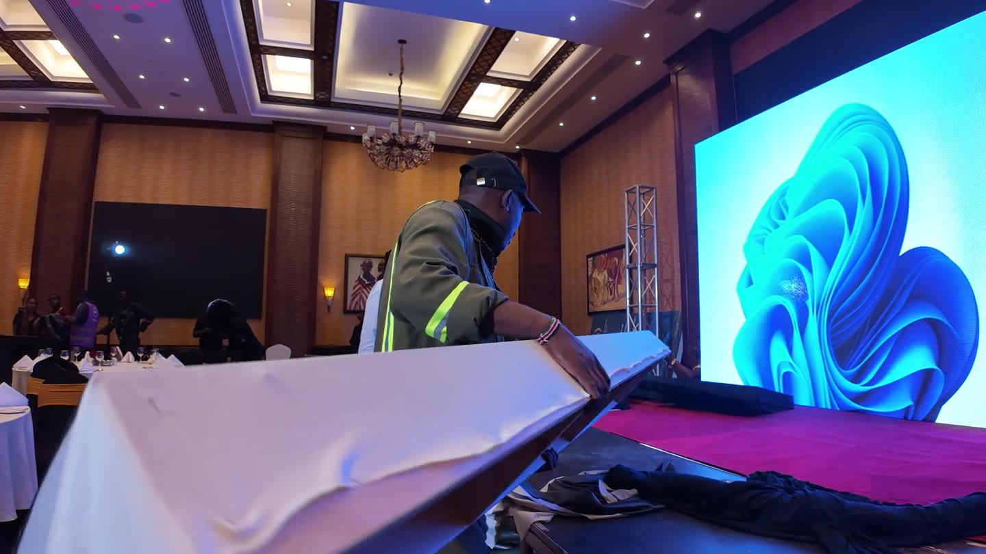 Red Giant crew installing the same Adobe stage before doors