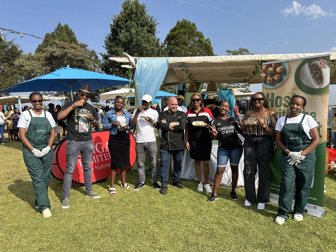 An activation crew photographed together in branded aprons