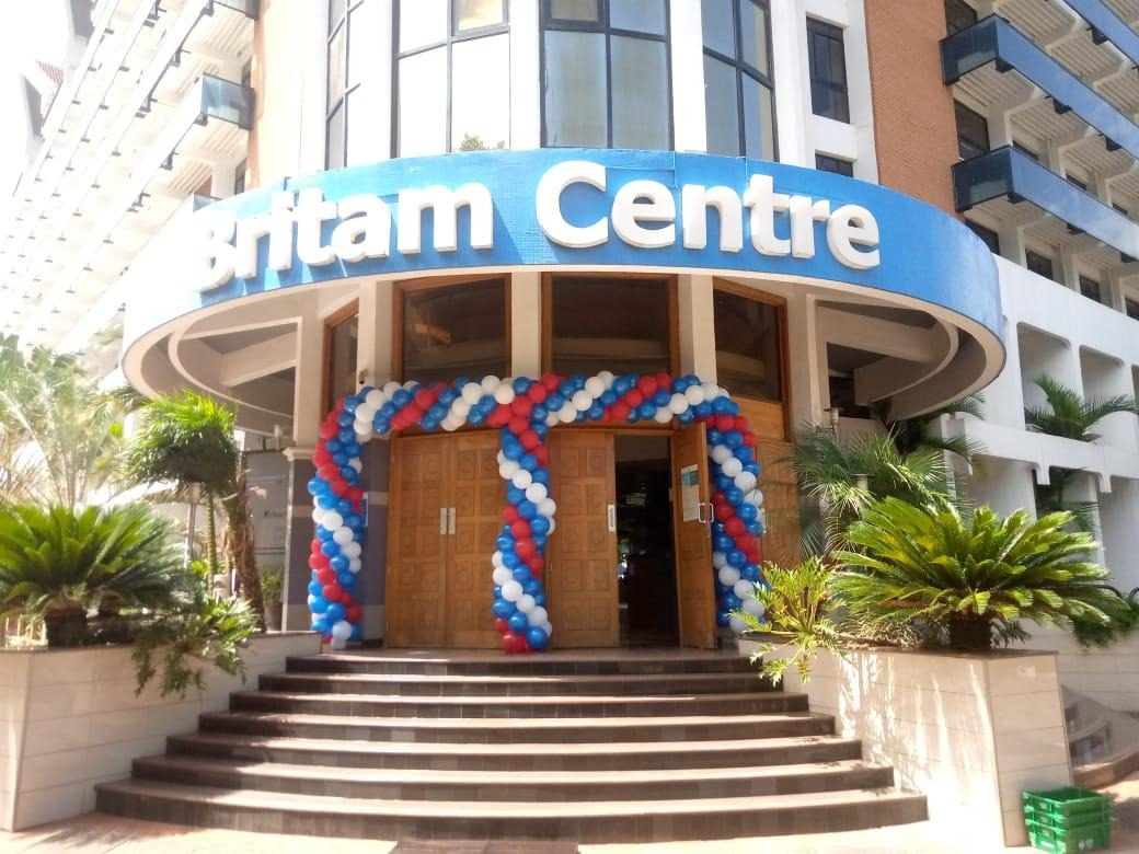 A building entrance dressed with a balloon arch