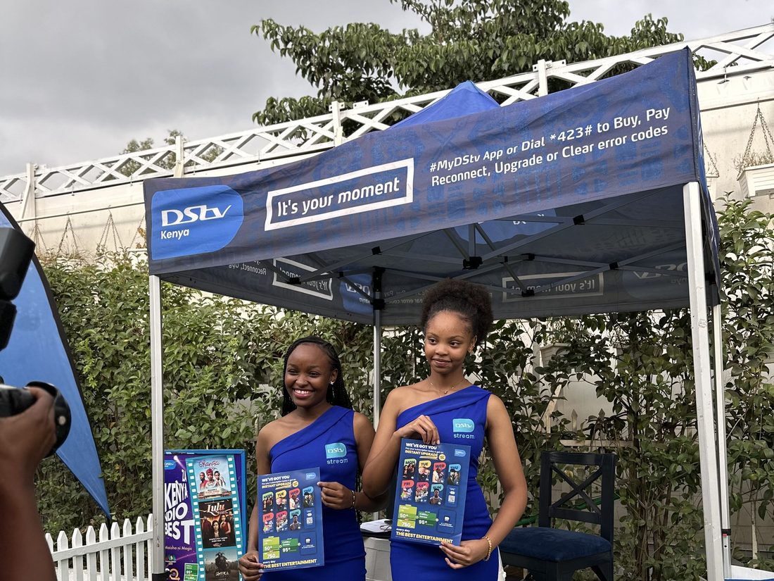 Two DStv brand ambassadors at a branded gazebo