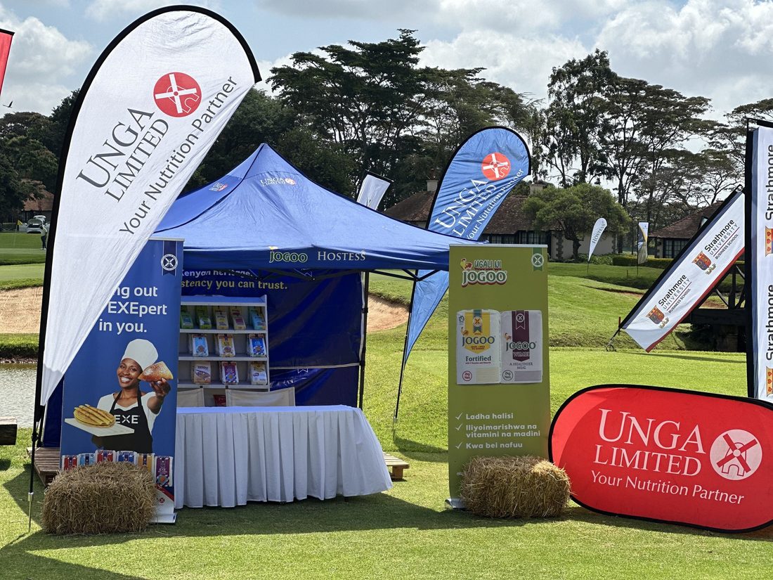 An Unga gazebo and product wall set up on a lawn