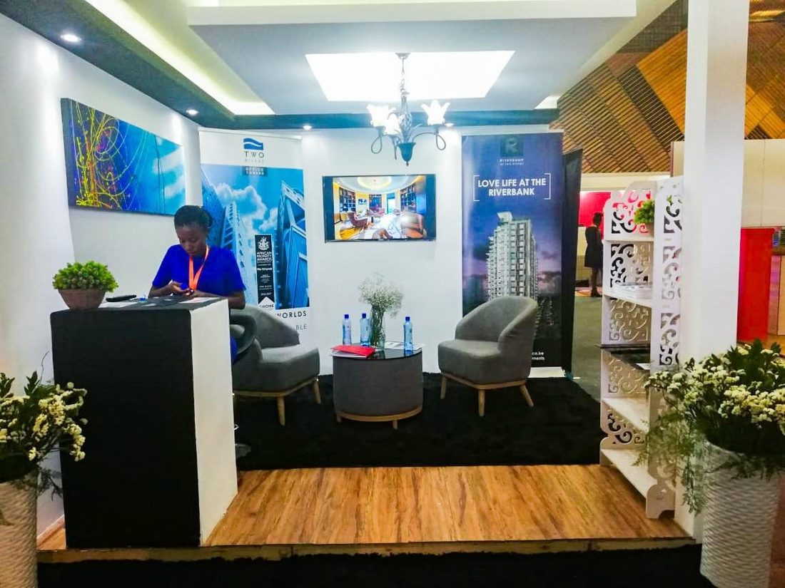 A host working the reception desk of a property stand