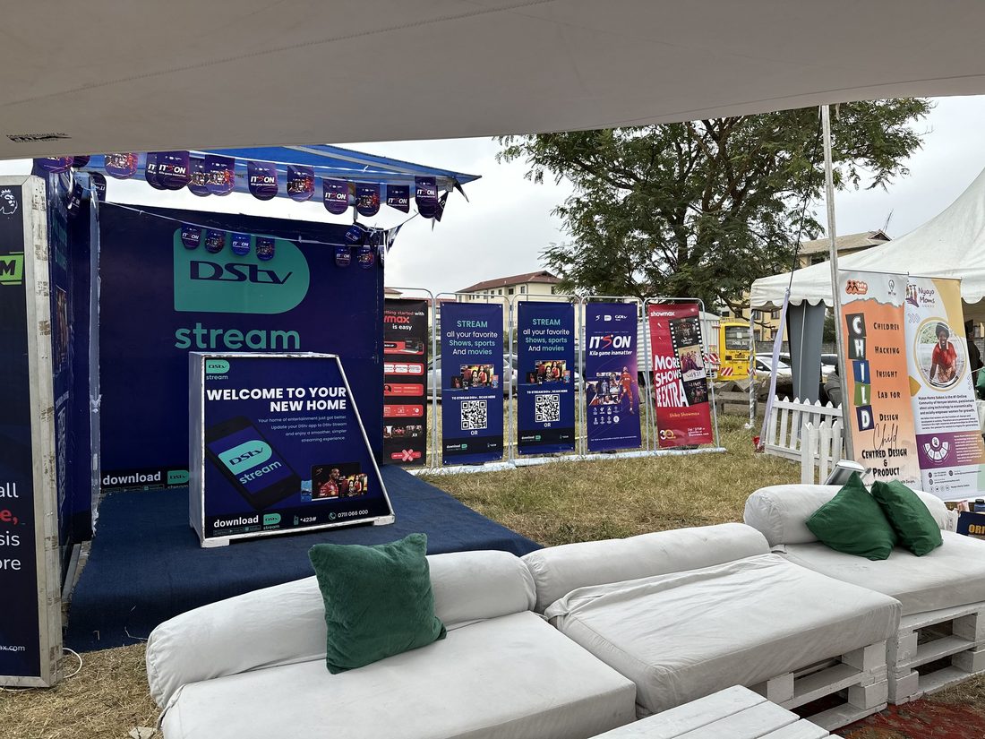An outdoor DStv and Showmax stand with pallet lounge seating