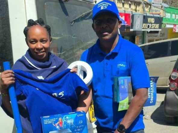A DStv crew working outside a shopfront
