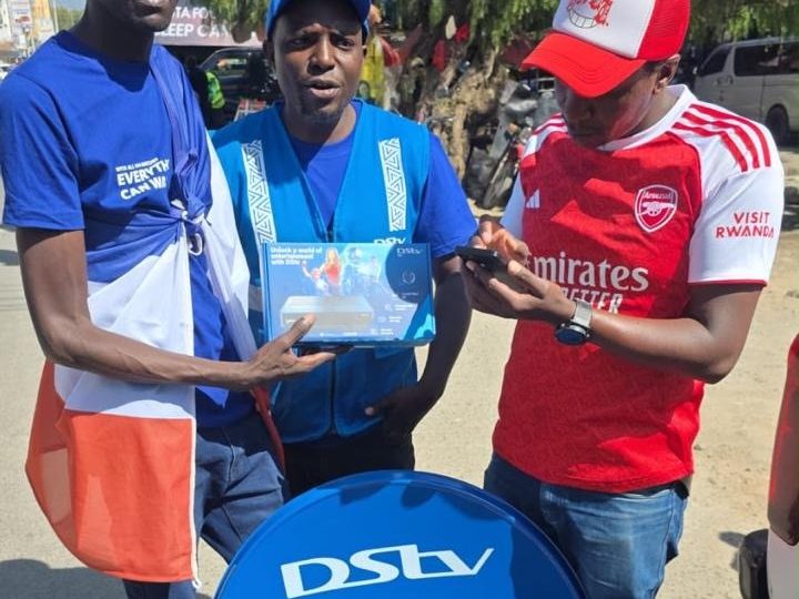 A promoter handing over a branded satellite dish