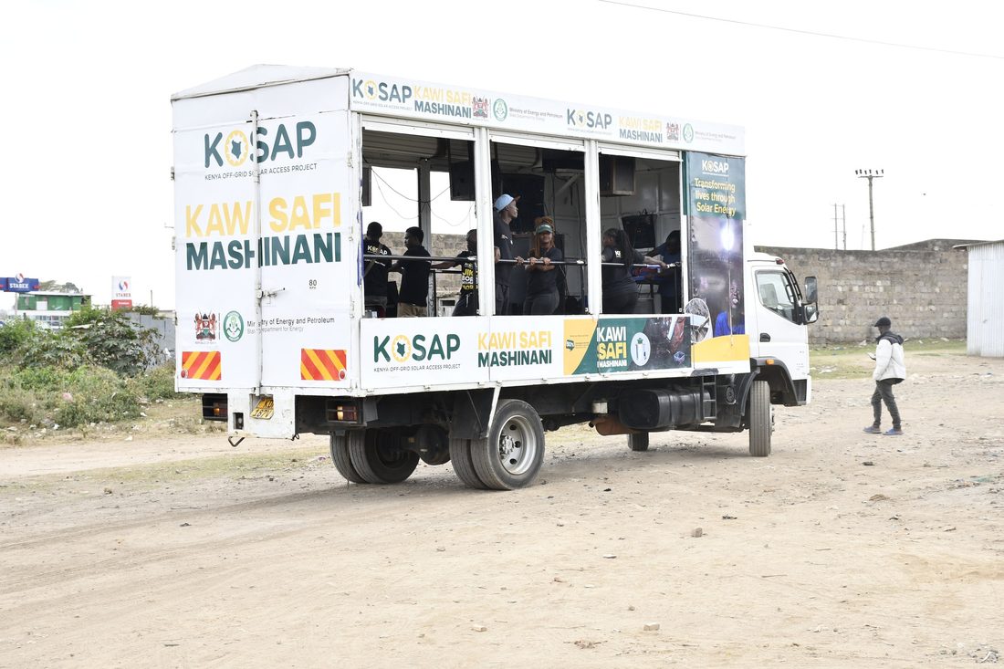 A K-SAP branded mobile unit on a dirt road with the service window open