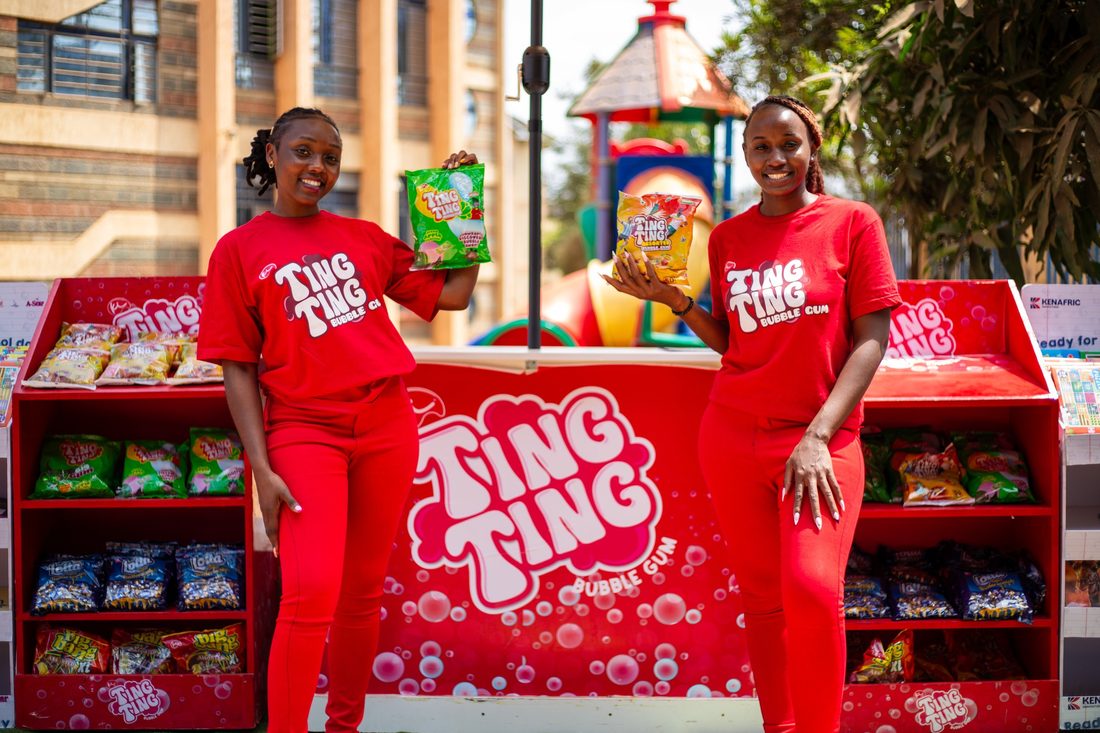 Two Ting Ting brand ambassadors either side of a stocked retail stand