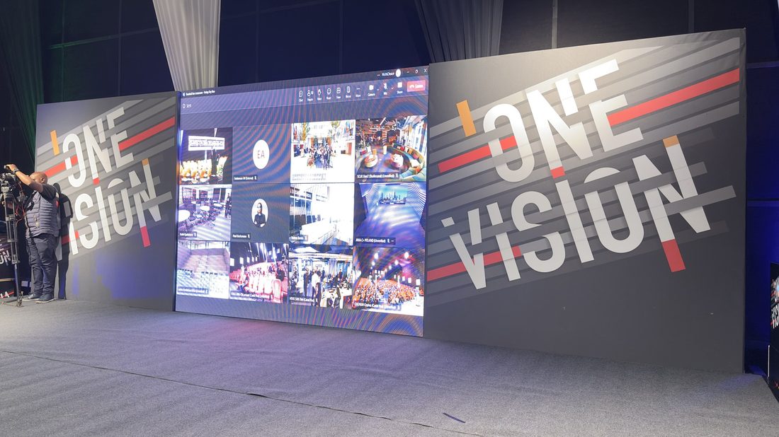 A full-height printed wall graphic forming the backdrop to a launch space