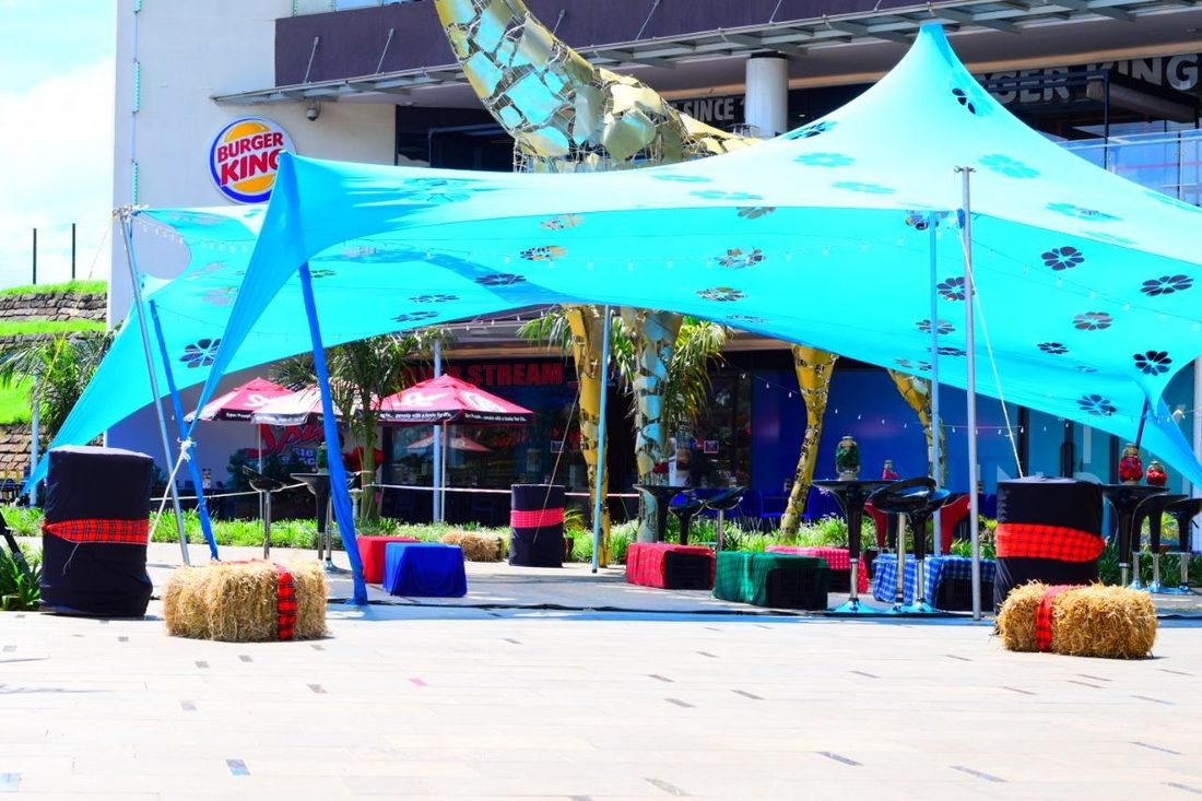 A forecourt lounge with colour-blocked seating drums