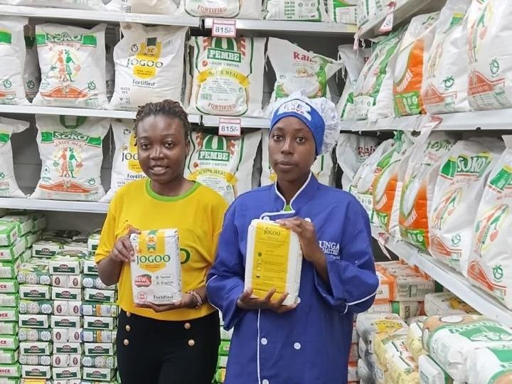Two representatives working the flour aisle of a supermarket