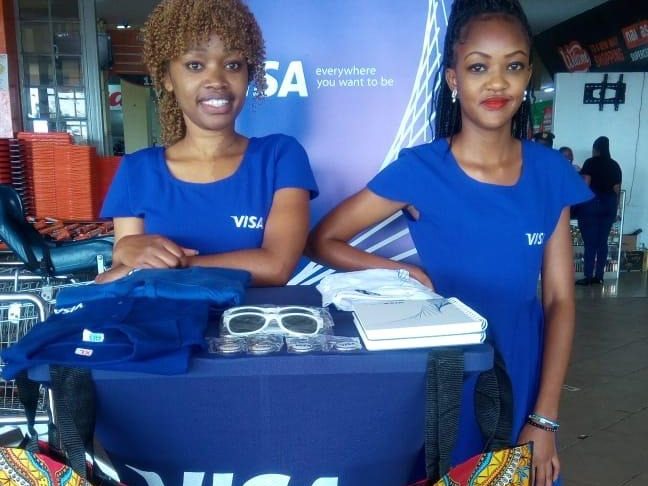 A branded VISA podium at a supermarket entrance