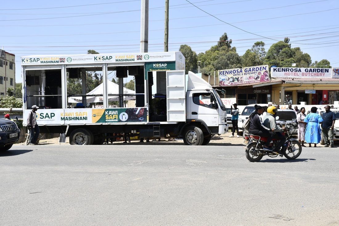 A K-SAP branded truck parked on a street with the service window open