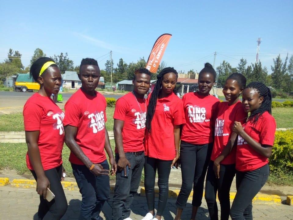 An eight-strong team in matching red tee shirts