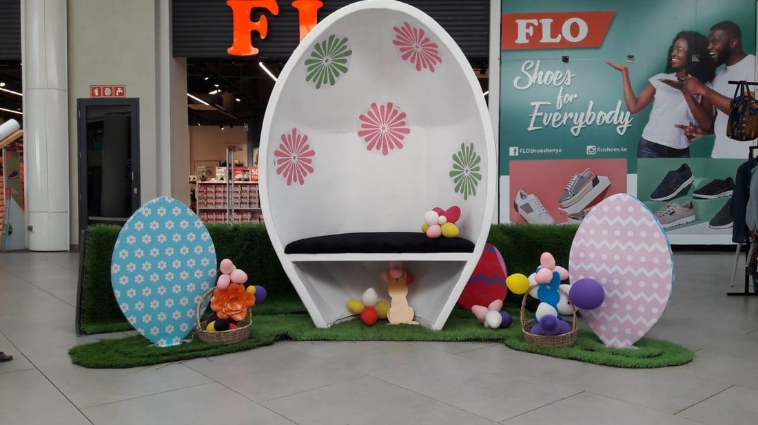 A seasonal egg installation with printed panels inside a shopping centre